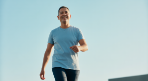 Person confidently walking after successful robotic knee replacement surgery, symbolizing renewed mobility and pain relief